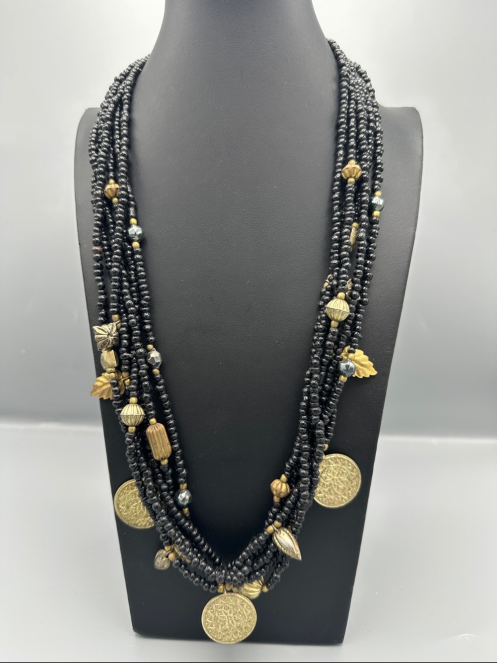 Multi-Strand Black Beaded Necklace with Gold Accents